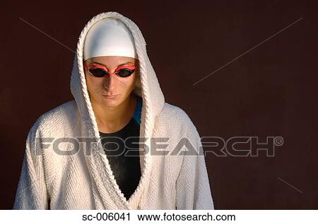 Stock Image - Female Swimmer Wrapped in Towels. Fotosearch