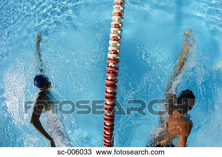 Stock Image - Male and Female Swimmer Racing. Fotosearch