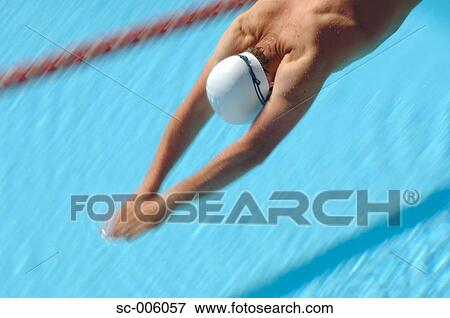 Stock Photo - Male Swimmer Diving. Fotosearch