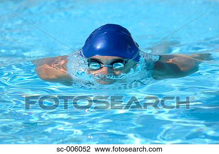 Stock Image - Male Swimmer Gliding Underwater. Fotosearch