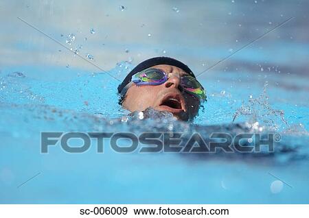 Stock Photo - Male Swimmer Swimming Backstroke. Fotosearch