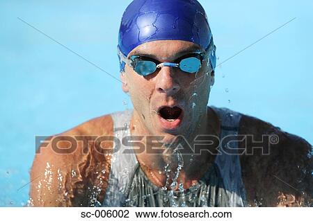 Stock Image - Male Swimmer Swimming Butterfly. Fotosearch