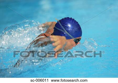 Stock Image - Male Swimmer Swimming Butterfly. Fotosearch