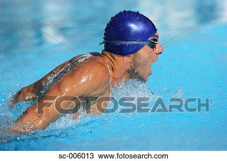 Stock Image - Male Swimmer Swimming Butterfly. Fotosearch