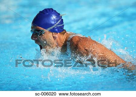 Stock Image - Male Swimmer Swimming Butterfly. Fotosearch