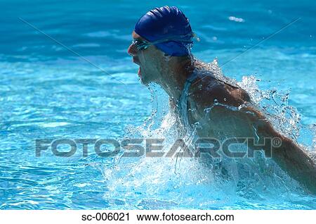Stock Image - Male Swimmer Swimming Butterfly. Fotosearch