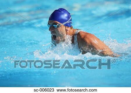 Stock Image - Male Swimmer Swimming Butterfly. Fotosearch