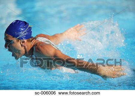 Stock Photograph - Male Swimmer Swimming Butterfly. Fotosearch