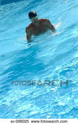 Stock Photography - Male Swimmer Swimming Butterfly. Fotosearch