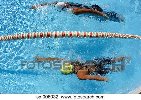 Stock Image - Two Female Swimmers Racing. Fotosearch