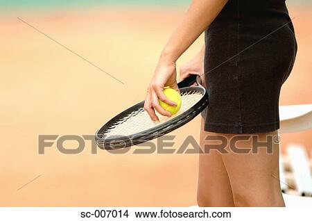 Picture - Close-Up of Female Tennis Player Holding Ball. Fotosearch