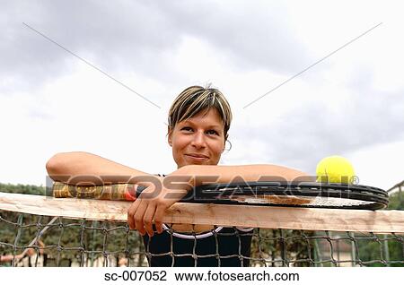 Female Tennis Player Leaning on Net View Large Photo Image Stock Image - Female Tennis Player Leaning on Net. Fotosearch
