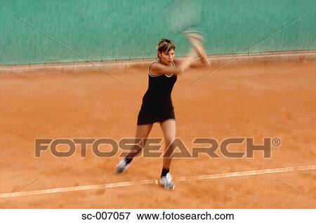 Stock Photo - Female Tennis Player Swinging Racquet, Racket. Fotosearch