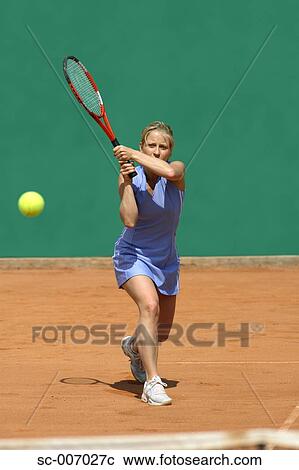 Stock Image - Front View of Female Tennis Player. Fotosearch