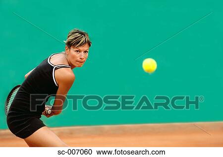 Stock Image - Front View of Female Tennis Player. Fotosearch