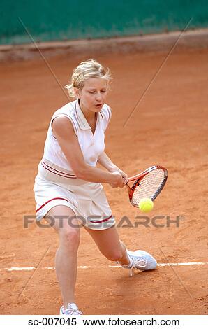 Front View of Female Tennis Player Hitting Ball View Large Photo Image Stock Photography - Front View of Female Tennis Player Hitting Ball. Fotosearch