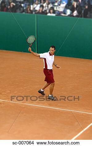 Male Tennis Player Hitting Backhand View Large Photo Image Picture - Male Tennis Player Hitting Backhand. Fotosearch
