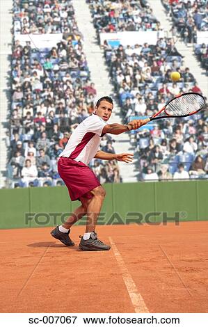 Male Tennis Player Hitting Backhand View Large Photo Image Stock Photo - Male Tennis Player Hitting Backhand. Fotosearch