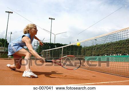 Side View of Female Tennis Player Hitting Ball View Large Photo Image Stock Image - Side View of Female Tennis Player Hitting Ball. Fotosearch