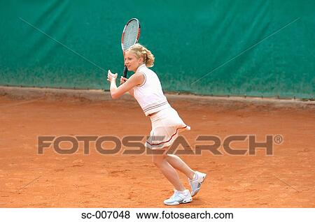 Stock Photo - Side View of Female Tennis Player. Fotosearch