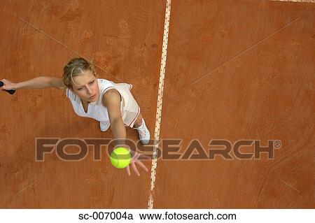 Top View of Female Tennis Player Mid-Serve View Large Photo Image Stock Image - Top View of Female Tennis Player Mid-Serve. Fotosearch
