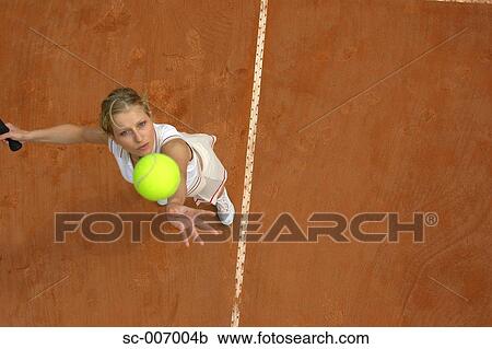 Top View of Female Tennis Player Mid-Serve View Large Photo Image Stock Image - Top View of Female Tennis Player Mid-Serve. Fotosearch