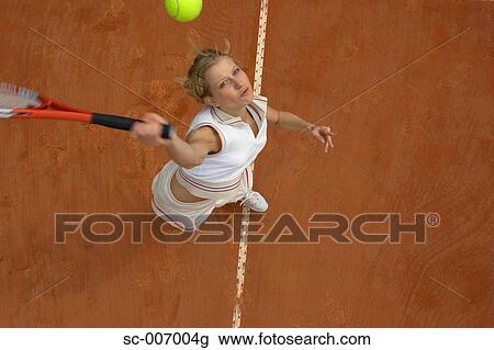 Top View of Female Tennis Player Mid-Serve View Large Photo Image Stock Image - Top View of Female Tennis Player Mid-Serve. Fotosearch
