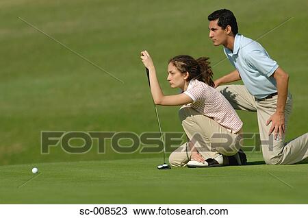 Couple Planning a Golf Shot View Large Photo Image Stock Image - Couple Planning a Golf Shot. Fotosearch