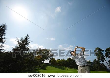 Man making a golf stroke with full strength View Large Photo Image Stock Photograph - Man making a golf stroke with full strength. Fotosearch