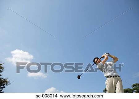 Portrait of a man making a golf swing View Large Photo Image Picture - Portrait of a man making a golf swing. Fotosearch