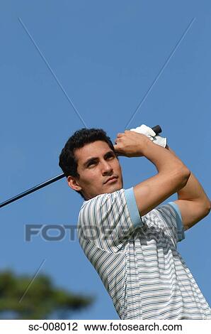 Portrait of a man making a golf swing View Large Photo Image Stock Image - Portrait of a man making a golf swing. Fotosearch