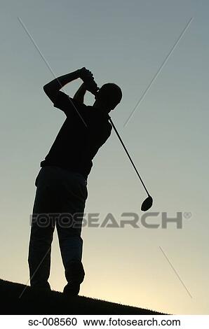 Stock Image - Silhouette of a Male Golfer Swinging a Golf Club. Fotosearch
