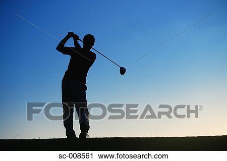 Stock Image - Silhouette of a Male Golfer Swinging a Golf Club. Fotosearch