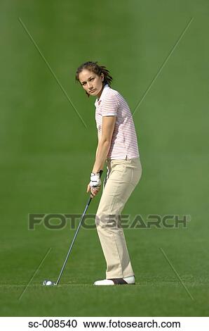 Young Female Golfer Preparing for a Golf Shot View Large Photo Image Stock Image - Young Female Golfer Preparing for a Golf Shot. Fotosearch