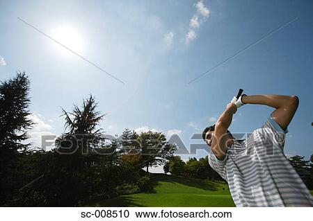 Stock Image - Young Man Playing Golf. Fotosearch