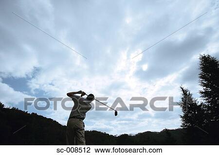 Stock Image - Young Man Playing Golf. Fotosearch