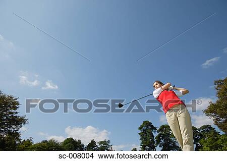 Young woman playing golf View Large Photo Image Picture - Young woman playing golf. Fotosearch