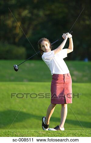 Young Woman Playing Golf View Large Photo Image Stock Image - Young Woman Playing Golf. Fotosearch