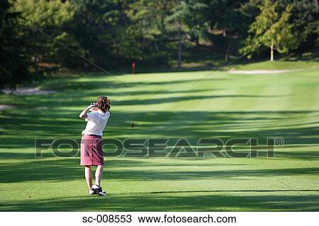 Young Woman Playing Golf View Large Photo Image Stock Image - Young Woman Playing Golf. Fotosearch