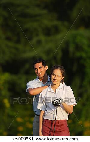 A happy couple smiles in front of the camera View Large Photo Image Stock Image - A happy couple smiles in front of the camera. Fotosearch