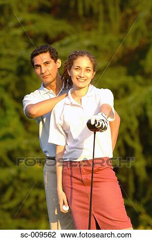 A happy couple smiles in front of the camera View Large Photo Image Stock Image - A happy couple smiles in front of the camera. Fotosearch