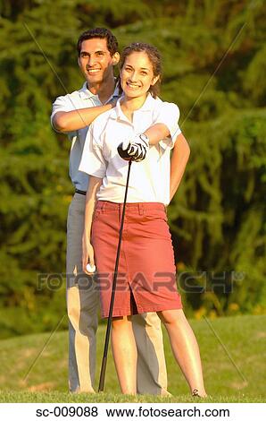 A happy couple smiling in front of the camera View Large Photo Image Stock Photo - A happy couple smiling in front of the camera. Fotosearch
