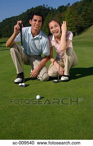 Couple together on the green View Large Photo Image Stock Image - Couple together on the green. Fotosearch