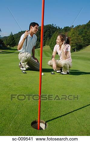 Couple together on the green View Large Photo Image Stock Image - Couple together on the green. Fotosearch