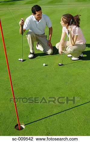 Couple together on the green View Large Photo Image Stock Image - Couple together on the green. Fotosearch