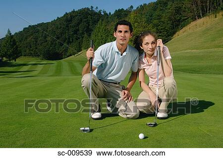 Couple together on the green View Large Photo Image Stock Photo - Couple together on the green. Fotosearch