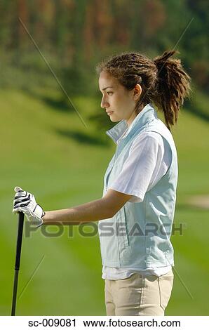 Female golfer deep in thought View Large Photo Image Stock Image - Female golfer deep in thought. Fotosearch