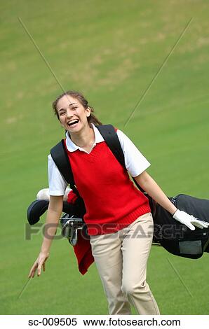 Stock Photography - Female golfer laughing. Fotosearch