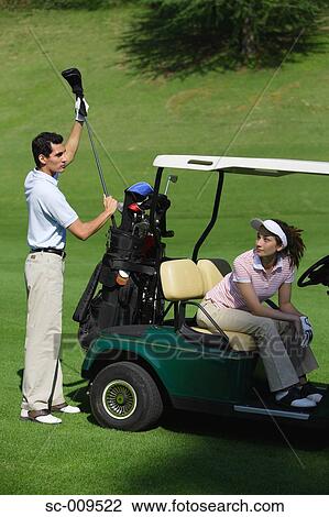 Male golfer selecting a club View Large Photo Image Stock Image - Male golfer selecting a club. Fotosearch