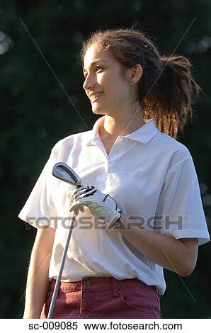 Portrait of a female golfer on a sunny day View Large Photo Image Stock Photography - Portrait of a female golfer on a sunny day. Fotosearch